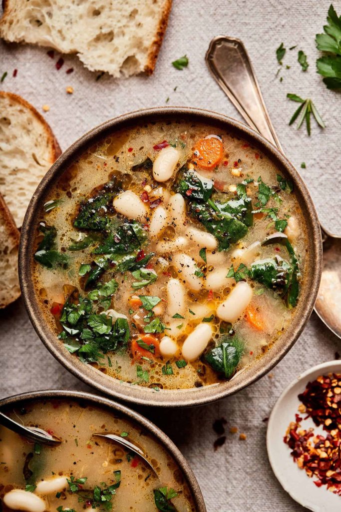 This Tuscan white bean and kale soup is Pinterest's most-saved vegan soup recipe. One pot, 35 minutes, deeply nourishing and Italian-inspired. The best easy vegan dinner for cold nights.